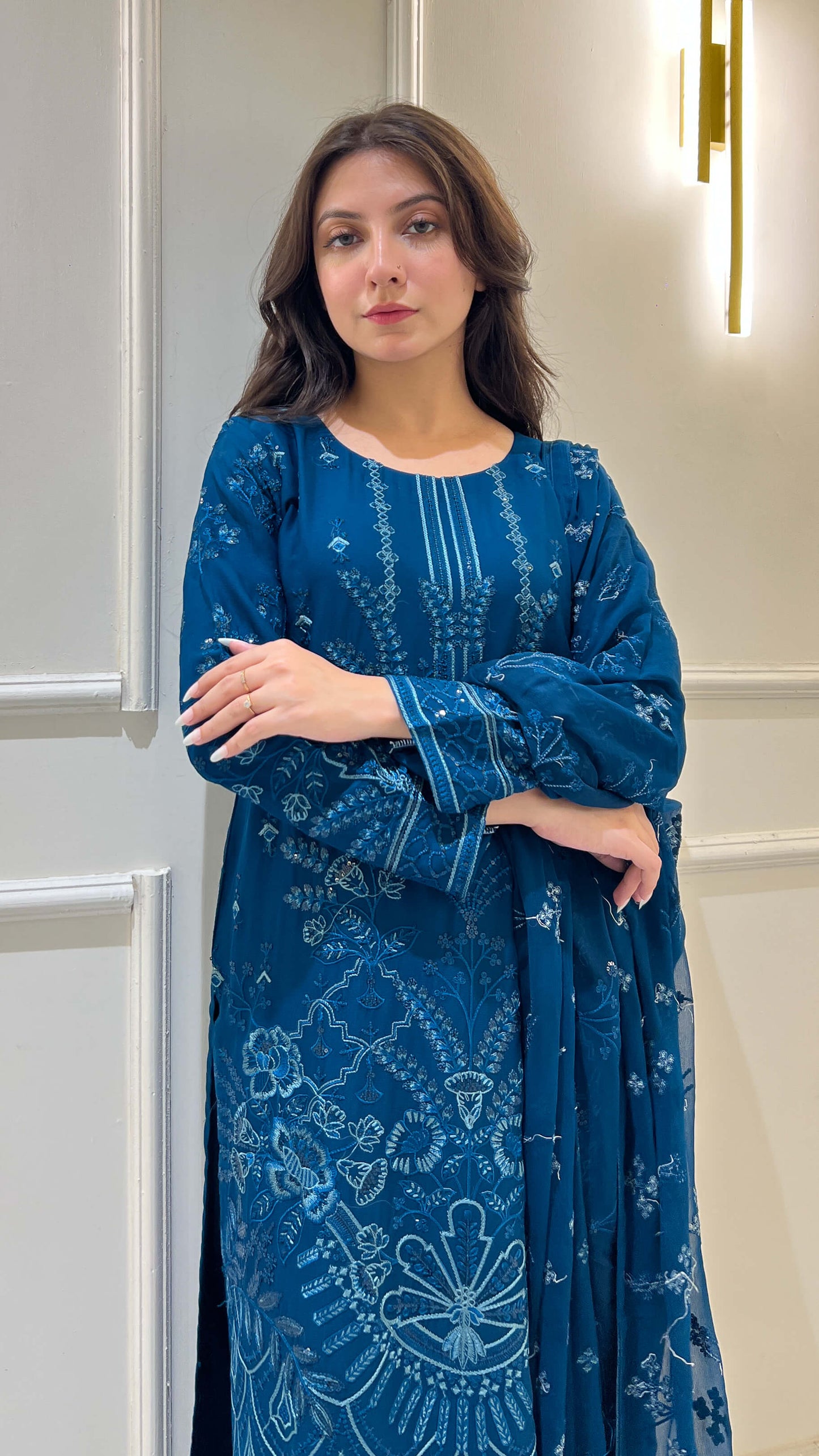 Close-up of embroidered peacock blue Shirt