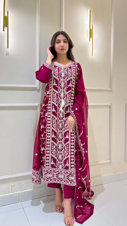 White thread embroidery detailing on magenta chiffon suit