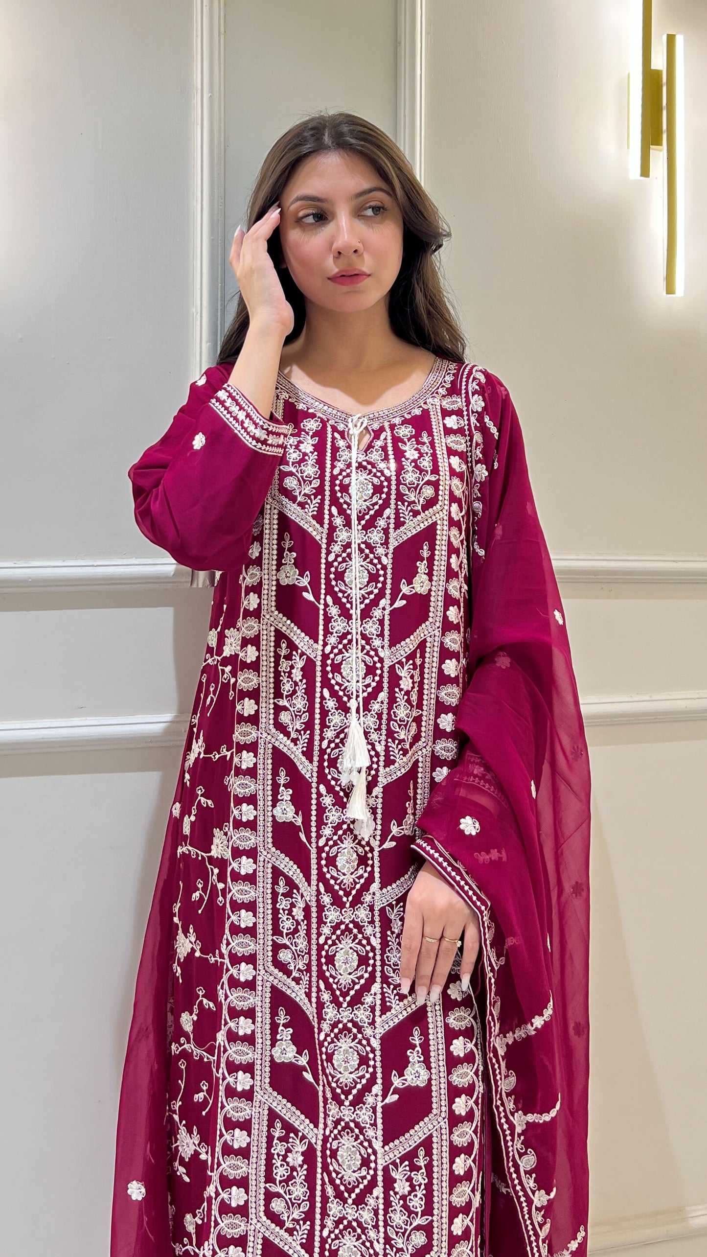 White thread embroidery detailing on magenta chiffon shirt and dupatta